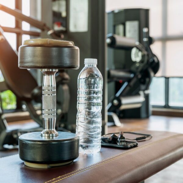 Dumbbell and a Bottled Water in a Gym